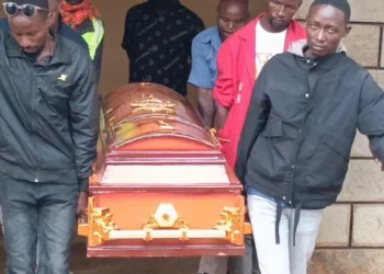 The body of James Muriithi Kamoni, a 41-year-old man who was fatally shot during the Saba Saba protests in Makutano, carried out of the mortuary.