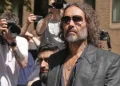English comedian and actor Russell Brand leaves Southwark Crown Court where he is charged with rape and sexual assault in London, Friday, May 30, 2025.
