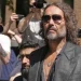 English comedian and actor Russell Brand leaves Southwark Crown Court where he is charged with rape and sexual assault in London, Friday, May 30, 2025.