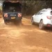 Police take away the body of a man that was discovered in the bush in Kutus.