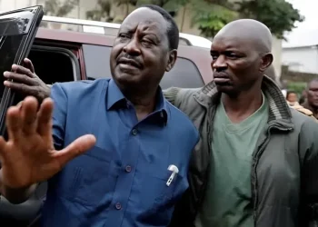 File image of the late former Prime Minister Raila Odinga and his bodyguard, Maurice Ogeta