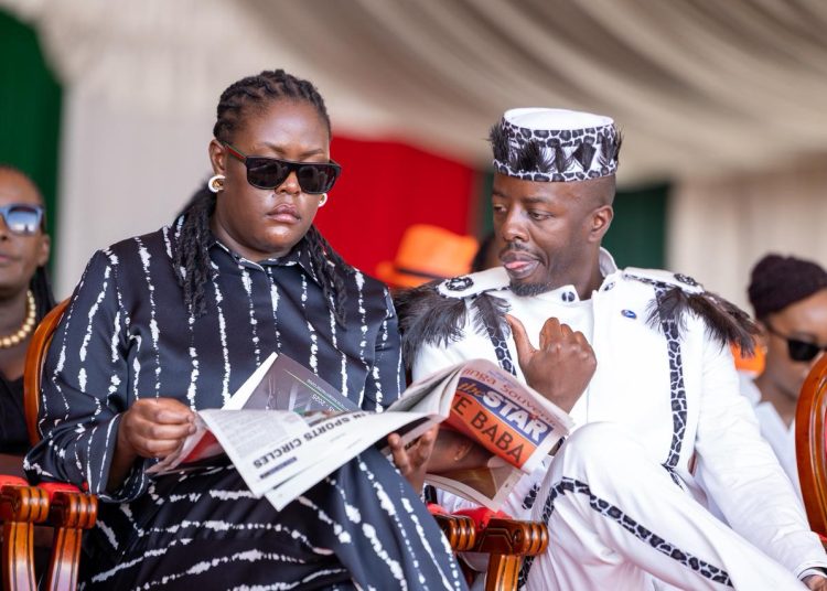 Winnie Odinga and her brother Raila Odinga Jnr during their father's funeral service at the Jaramogi Oginga Odinga University of Science and Technology, October 19, 2025.