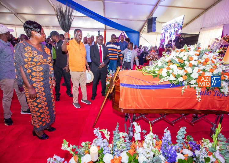 ODM Leader Raila Odinga waving his fly whisk at Ong'ondo Were burial, an exercise he conducts in a funeral as he chants Jowi, Jowi