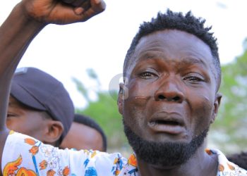 A man in tears as he mourns former Prime Minister Raila Odinga whose body is set to arrive at JKIA on October 16, 2025