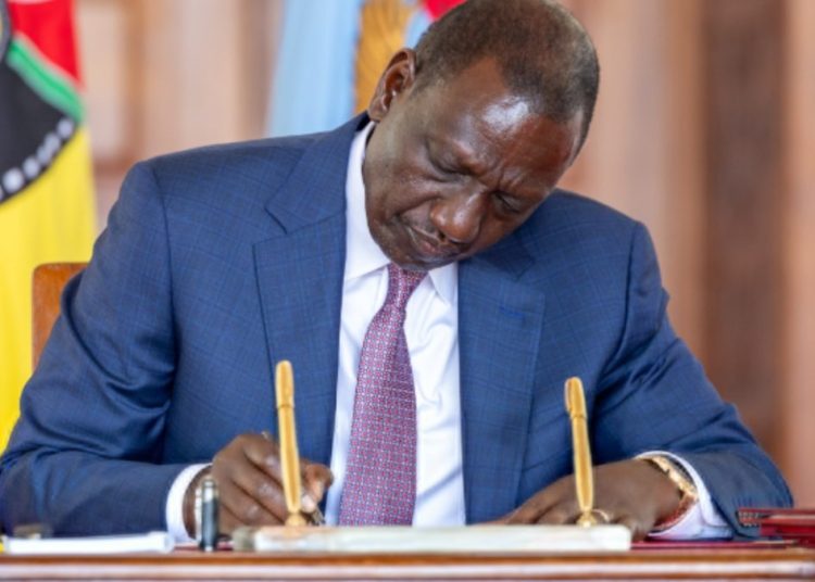 President William Ruto signs a bill at State House.