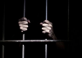A person in a prison cell.