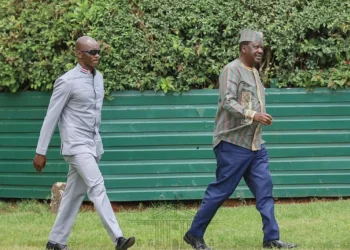 File image of Raila Odinga and his bodyguard Maurice Ogeta