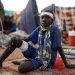 A boy sits at a camp for displaced people who fled from el-Fasher to Tawila, North Darfur, on October 27, 2025