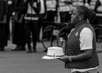 The late Raila Odinga's daughter, Winnie Odinga, carries his father's favourite hat after embarking from a plane that carried his remains on October 16, 2025