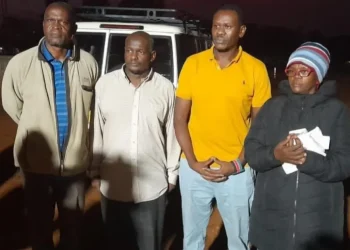 Kenyan activists Bob Njagi and Nicholas Oyoo arrive at the Busia border after being released by Ugandan authorities.