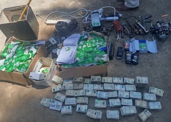 The suspects were discovered in possession of 2,464 national identity cards and over 3,000 SIM cards, which are thought to have been used to defraud members of the public via various mobile money scams.