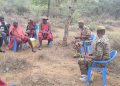 KWS officers hold a meeting with locals after an elephant killed a woman in Lairupa Village, Elangata Wuas Location, Kajiado West