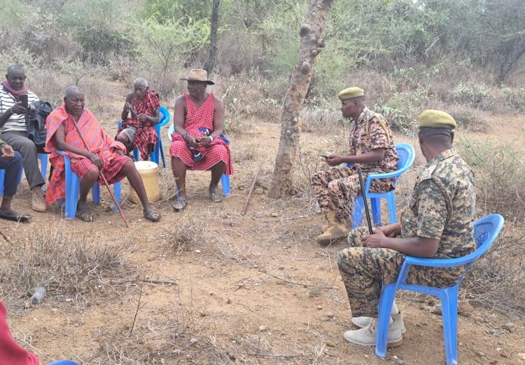 KWS officers hold a meeting with locals after an elephant killed a woman in Lairupa Village, Elangata Wuas Location, Kajiado West