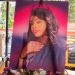 Betty-Bayos-portrait-during-her-burial-service