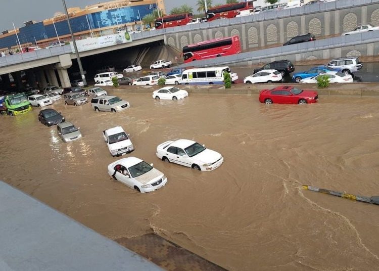 An image showing vehicles submerged in water.