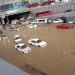 An image showing vehicles submerged in water.