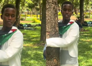 Stephen Gachanja doing his tree-hugging challenge.