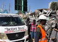 A car owned by the Wamatangi Foundation parked near the wreckage after the demolitions on January 14, 2026.