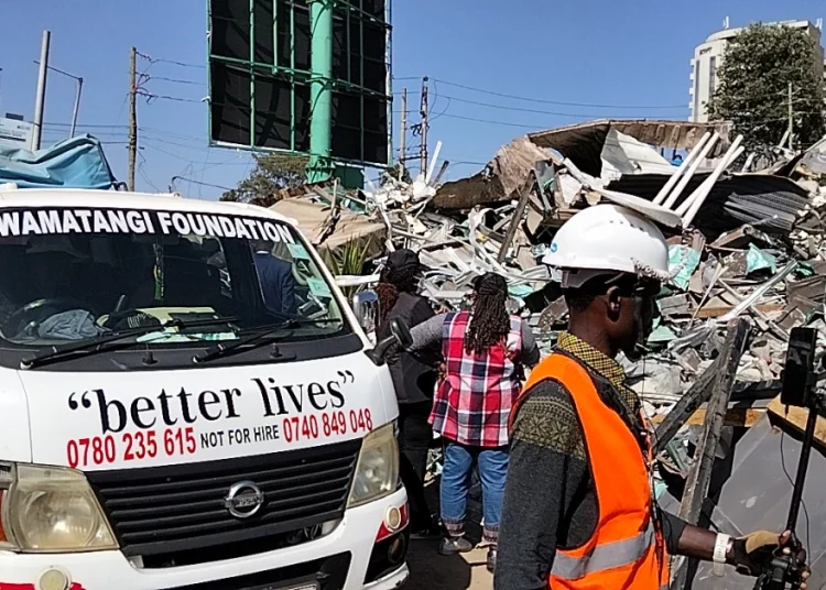 A car owned by the Wamatangi Foundation parked near the wreckage after the demolitions on January 14, 2026.