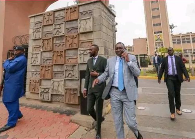 Kapsaret MP Oscar Sudi walking into parliament chambers.