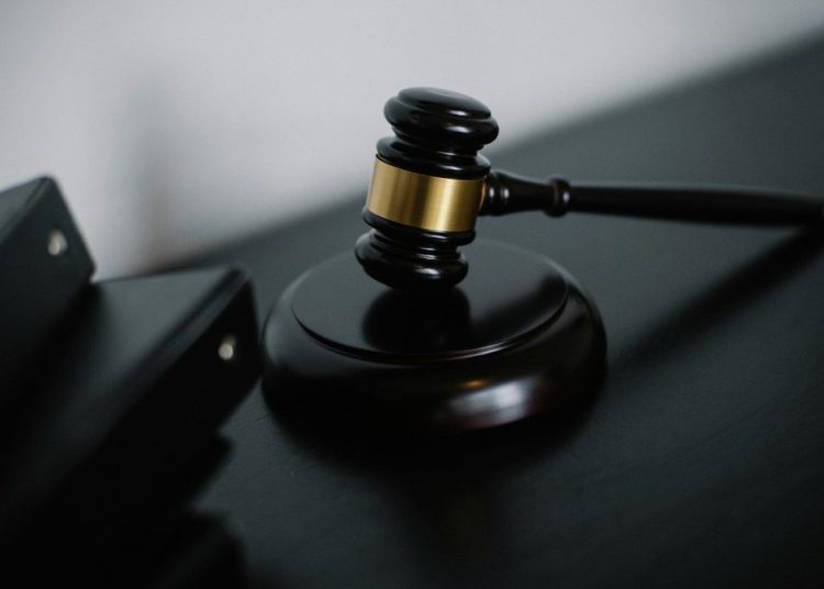 A gavel is placed on a sound block during a court session. Image used for illustration.
